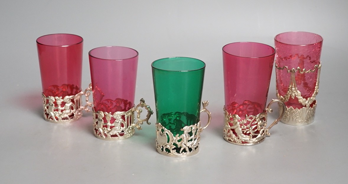 Five silver mounted glass tea holders - 9.5cm tall